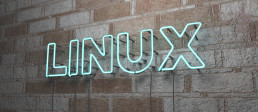 sign on brick wall that says linux