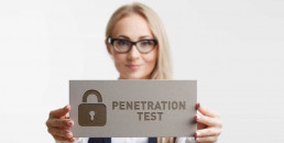 woman holding a sign that says penetration testing